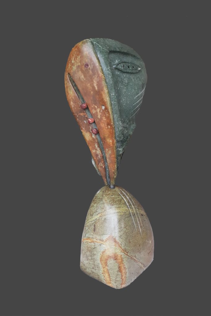 Raven Steals The Moon on base; two faces view