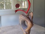 Spirit of Inua
Stone, antler, mahogany base.
Stone 17" H x 13" W x 6" D
Base: 5" H x 10" diameter
Total work is 3 feet high and 18" width	